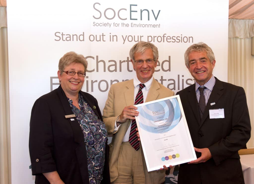 Colin Drummond receives his honorary fellowship from Society for the Environment chair Carolyn Roberts and president Tony Juniper